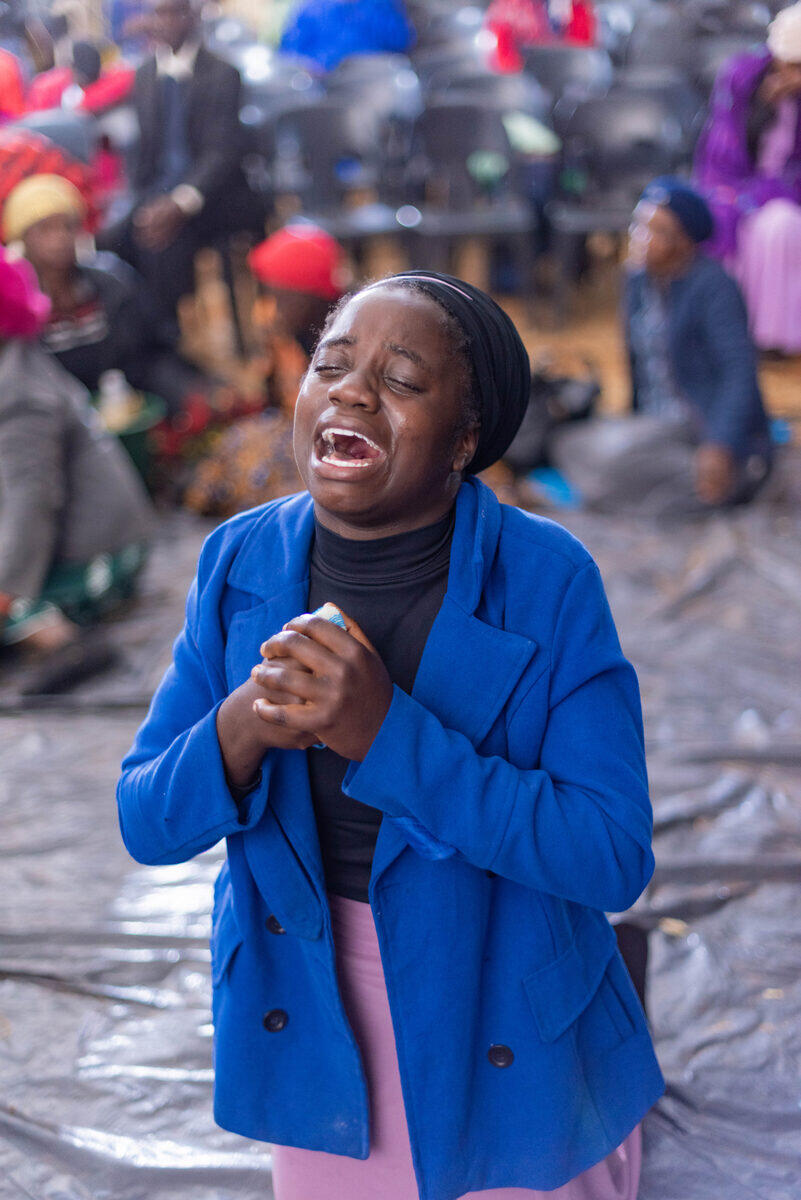 Young woman in fervent prayer
