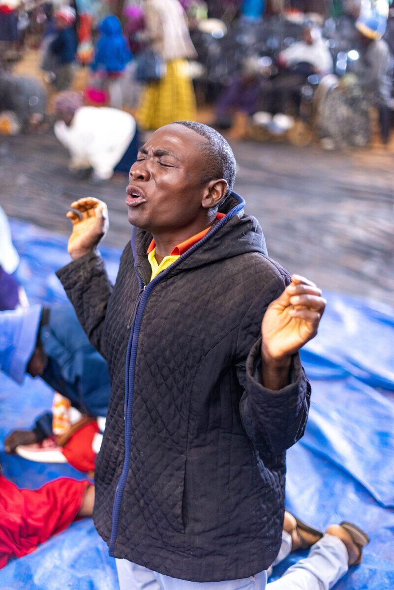 Man worshipping with raised hands