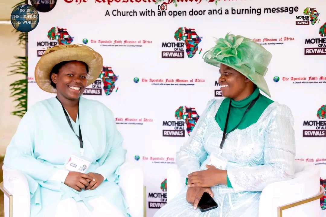 Mother Of All Revivals — two ladies at the event backdrop